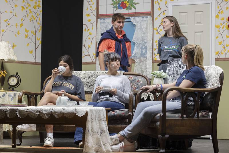 Faith Christian students Caleb Rydzynski and Laura Fisher (back) rehearse a scene with Emma Royer (left), Nadine Rios and Elyse Stevens Tuesday, May 16, 2023 for the school’s upcoming spring play “Every Crook and Nanny.”