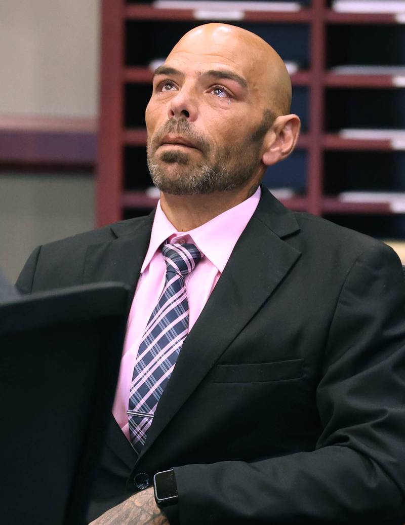 Nathan P. Sweeney, 45, of DeKalb, tries to compose himself as he apologizes to Christina Musil’s loved ones Tuesday, Aug. 26, 2025, as he reads a statement during his sentencing hearing at the DeKalb County Courthouse in Sycamore. Sweeney received 14 years in prison for driving under the influence and causing the 2024 crash that killed Musil, a mother, sheriff's deputy and military veteran.
