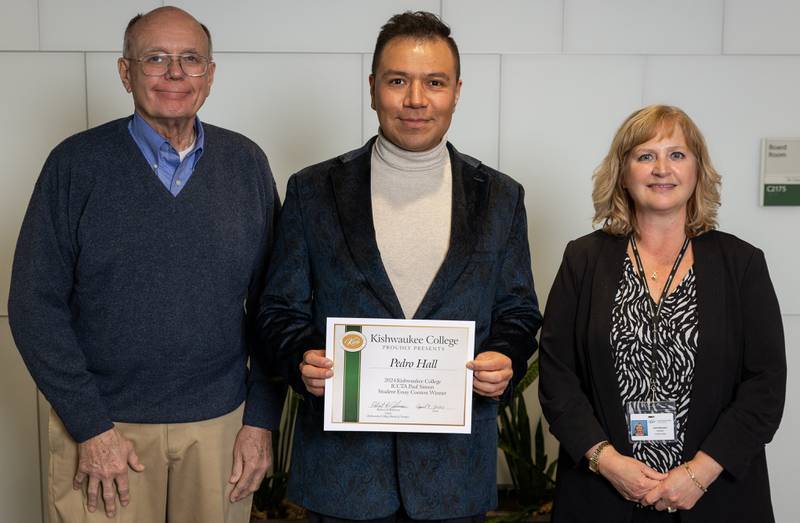 (Left to right); Kishwaukee College board of trustees chair Bob Johnson, Pedro Hall, and Kishwaukee College president Laurie Borowicz