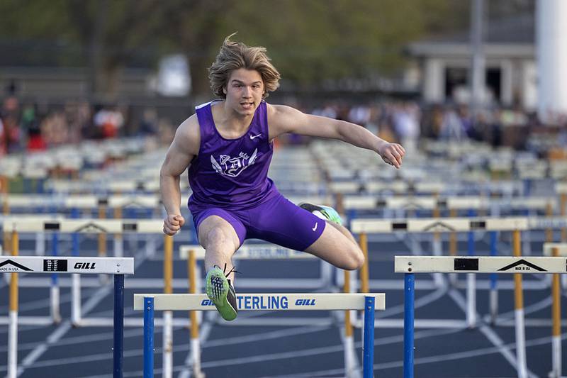 Dixon’s Dawson Kemp clears the last hurdle of his leg of the 110 boys shuttle hurdle relays Thursday, April 27, 2023  at the Sterling Night Relays.