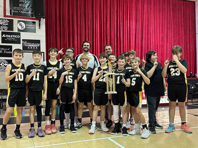 The Putnam County Pumas sixth-grade basketball team defeated Mendota Holy Cross 29-20 to capture the Oglesby Holy Family on Saturday, finishing undefeated. Team members are (front row, from left) Liam Judd, Wyatt Rue, Mylo Mertel, Jacob Borri, Hans Frund and Sean King; and (back row) Hudson Heiberger, Marshall Holocker, Liam Askeland, Coach TJ Askeland, Coach Mike Borri, Michael Padilla, Eli Schrowang, Jace Newsome, Denny Long and Mason King.