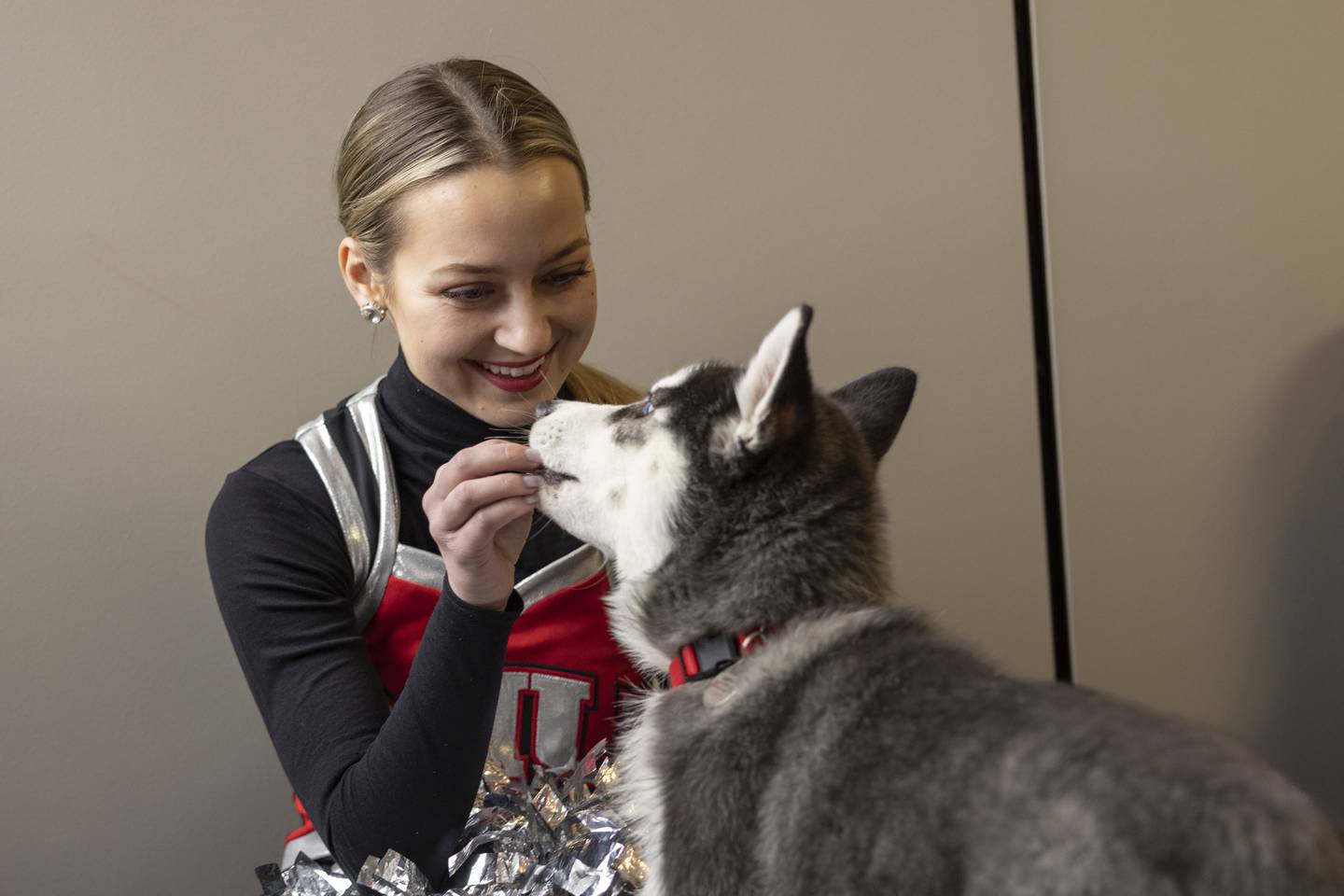 Mission II meets a Silverette at his introduction, Friday, Jan. 27, 2023 at Northern Illinois University. (Photo provided by Northern Illinois University)