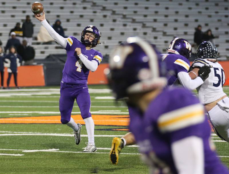 Williamsville's quarterback Lake Seman (4) throws a pass down the field in the Class 3A State title game on Friday, Nov. 25, 2022 at Memorial Stadium in Champaign.