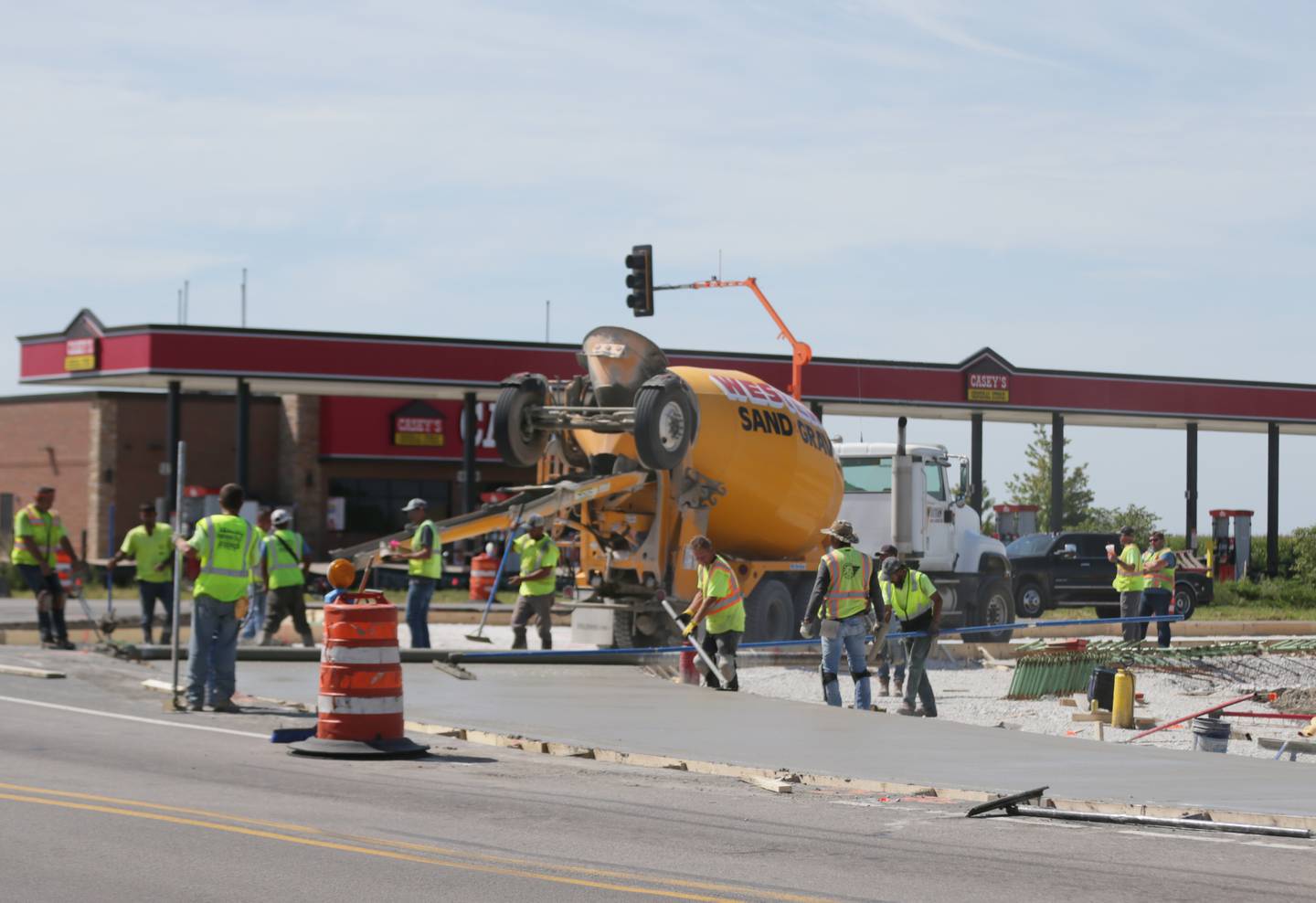 Workers pave the roundabout at the intersection of 178 and U.S. Route 6 on Thursday, Sept. 1, 2022 in Utica.