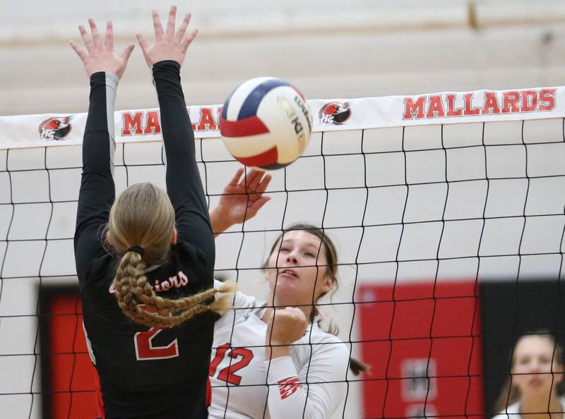 Henry-Senachwine's Kaitlyn Anderson spikes the ball past Woodland's Ella Derossett on Thursday, Oct. 3, 2024 at Henry-Senachwine High School.