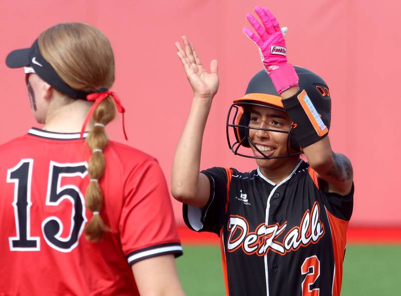 DeKalb’s Nazeria Dean reacts after arriving at first base with a single against Huntley in IHSA Class 4A Sectional Semifinal softball action at Barrington High School in Barrington on Wednesday, June 4, 2025.