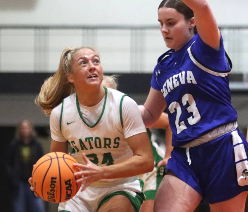 Crystal Lake South’s Gracey LePage, left, works past Geneva’s Nora Hatton in girls IHSA Class 3A Sectional Championship basketball on Thursday, Feb. 26, 2026, at Crystal Lake Central High School in Crystal Lake.