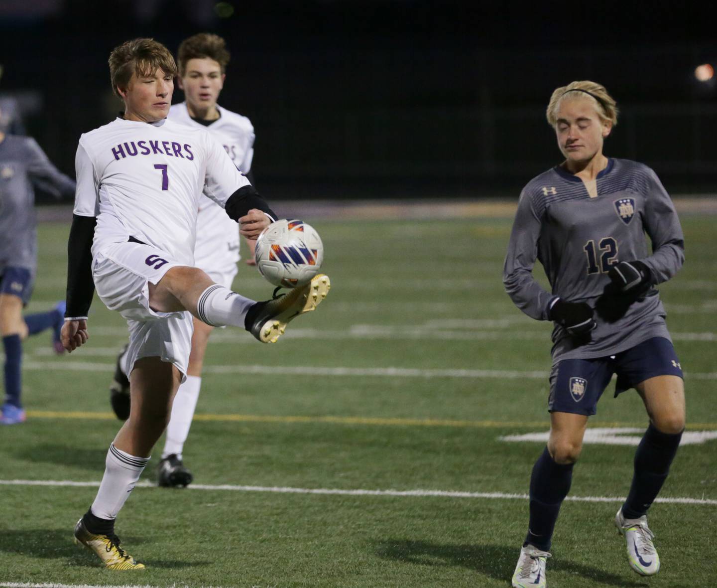 Serena's Matt Farrell (7) kicks the ball down the field past Quincy Notre Dame's John Drew (2) during the Class 1A Sectional semifinal soccer match on Wednesday, Oct. 19, 2022 in Mendota.