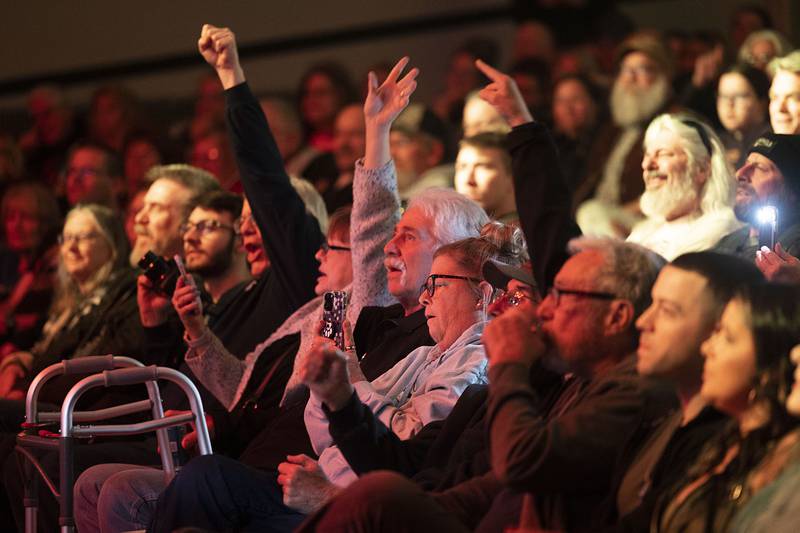 Fans of Head East sing along and gesture Saturday, April 22, 2023 during their show at the Dixon Historic Theatre.