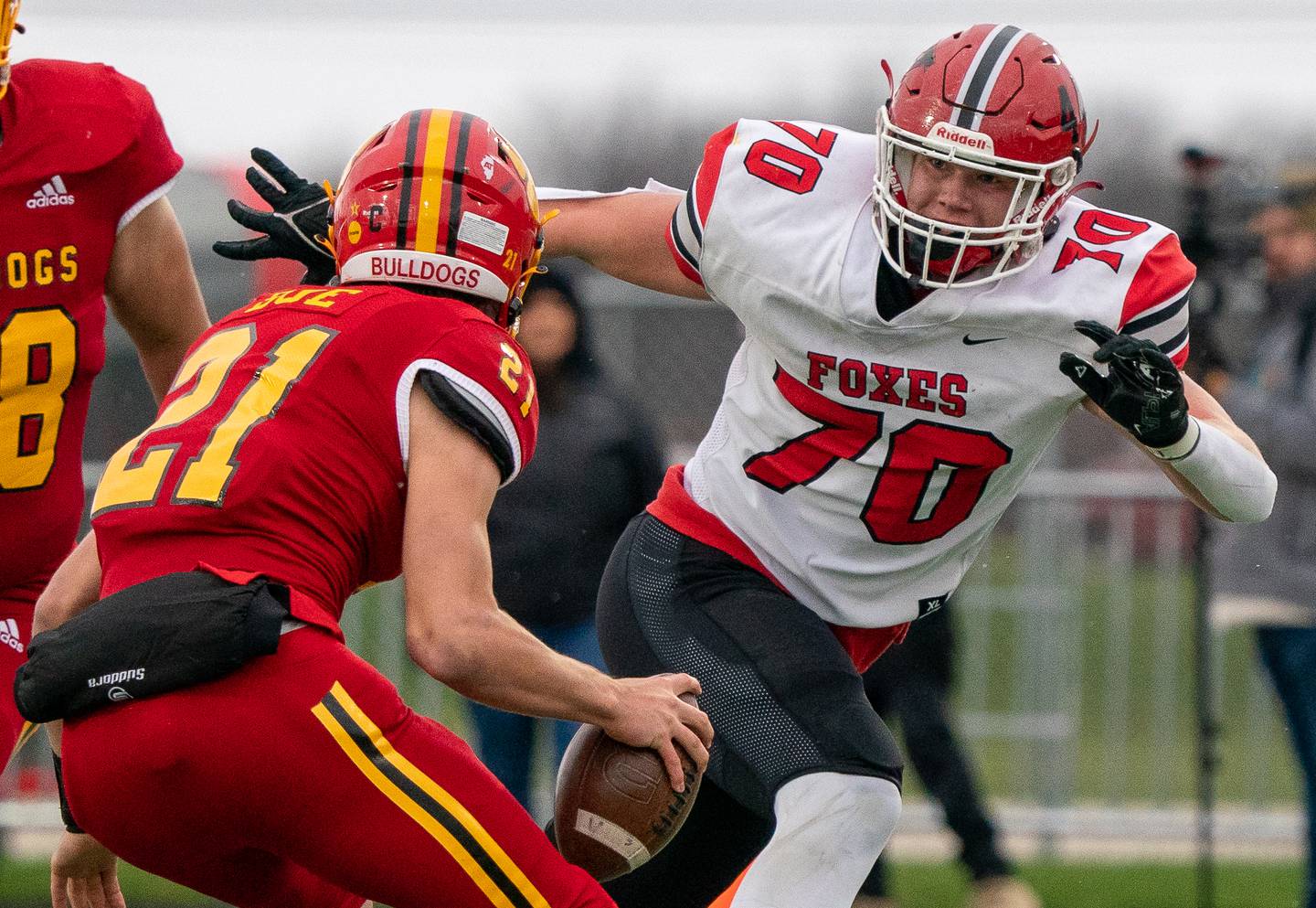 Yorkville's Jake Davies (70) pressures Batavia’s Ryan Boe (21) during a 7A quarterfinal playoff football game at Batavia High School on Saturday, Nov 12, 2022.