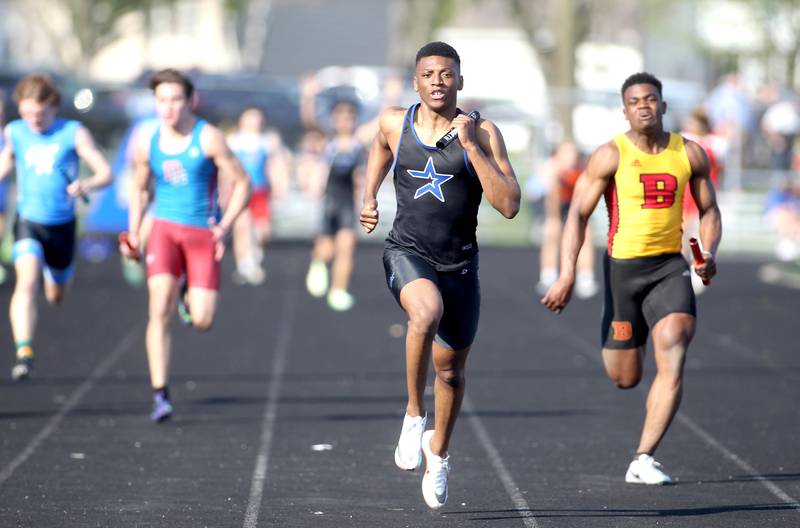 St. Charles North’s Joshua Duncan sprints to the finish as the anchor leg of the 400-meter relay during the Kane County Boys Track and Field Invitational at Geneva High School on Monday, May 9, 2022.