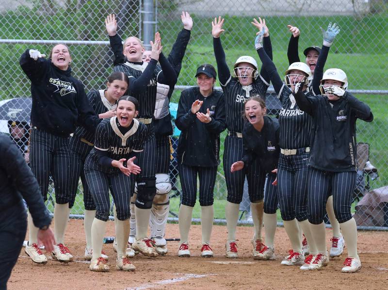 Sycamore players wait for teammate Kairi Lantz at home after she homered Thursday, April 30, 2026, during their game against LaSalle-Peru at Sycamore High School.