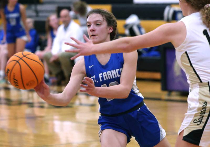 Sycamore's Katherine Elsner passes the ball away from the pressure go Sycamore's Katherine Elsner during their game Thursday, Jan. 4, 2023, at Sycamore High School.