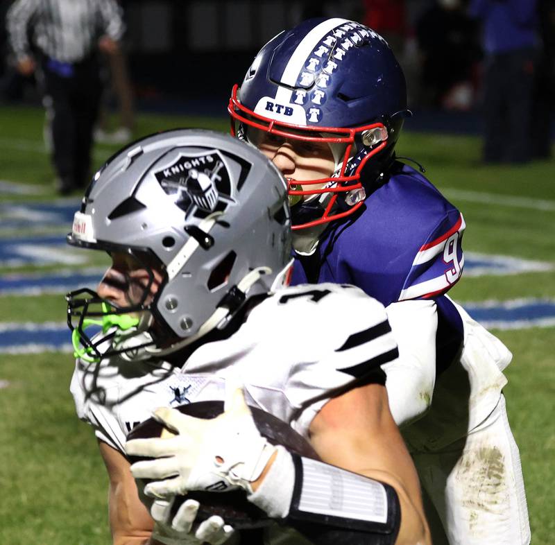 Kaneland's Brady Brown catches a touchdown pass in front of Belvidere North's Nolan Vaughn Friday, Nov. 7, 2025, during their Class 5A second round playoff game at Belvidere North High School.
