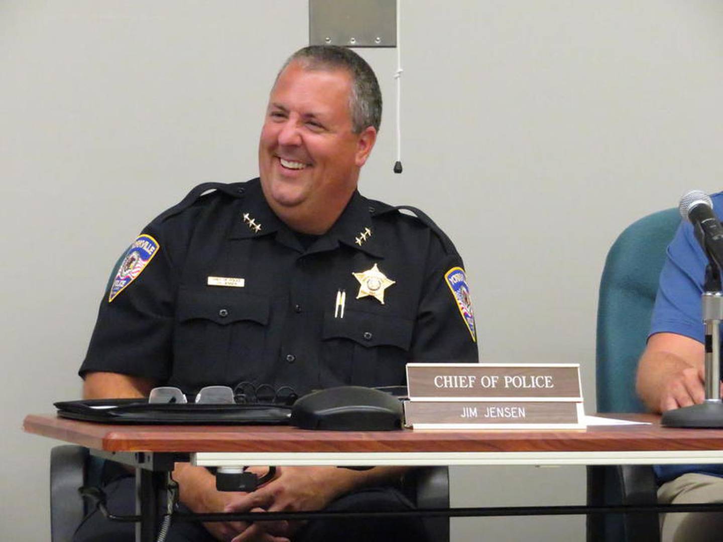 Yorkville Police Chief Jim Jensen takes his official seat shortly after being sworn in during the City Council meeting Tuesday, Aug. 13 at City Hall, 800 Game Farm Road in Yorkville.