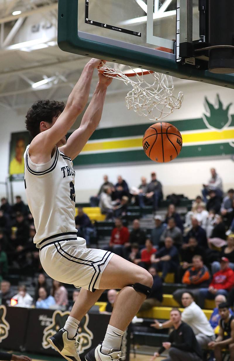Cary-Grove's Adam Bauer dunks the basketball during an IHSA Class 3A Crystal Lake South Regional boys basketball semifinal game against Marmion on Wednesday, February, 25, 2026, at Crystal Lake South High School.