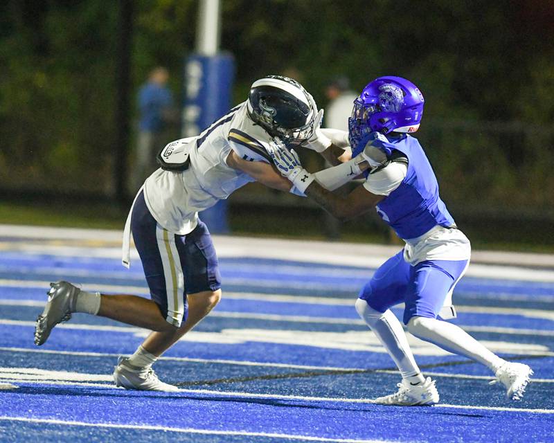 IC Catholic Prep's Grant Bowen (11) defends St. Francis's Javonte Williams (8) during the game on Friday Oct. 3, 2025, held at St. Francis High School.