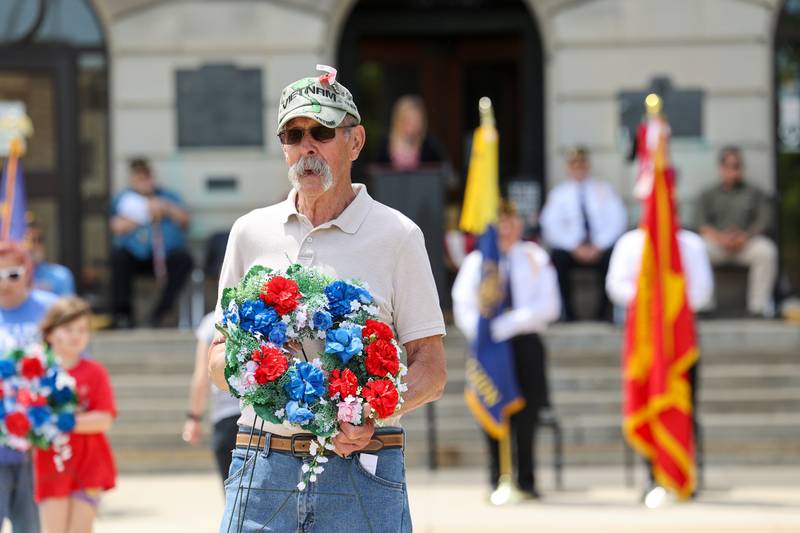 Tom Sovinski, a U.S. Army Vietnam veteran of Kankakee, helps place wreaths on Monday, May 26, 2025, during the Kankakee County Veterans' Council annual Memorial Day Ceremony at the Kankakee County Courthouse.