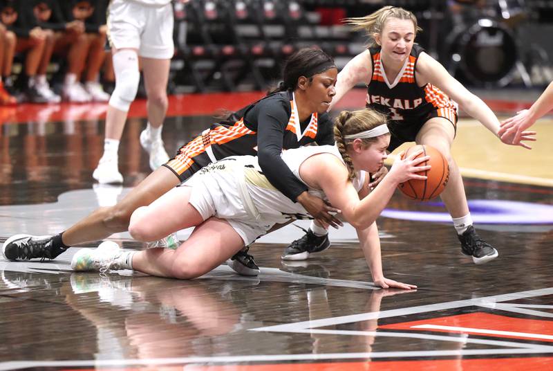 DeKalb's Cayla Evans (left) and Ella Russell try to get a loose ball away from Sycamore's Sophia Klacik during the First National Challenge Friday, Jan. 27, 2023, at The Convocation Center on the campus of Northern Illinois University in DeKalb.