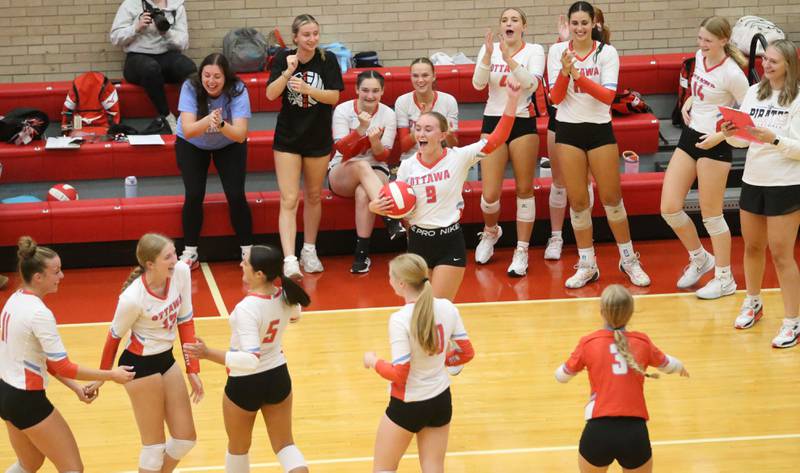 Members of the Ottawa girls volleyball team react after winning the second set over Pontiac on Tuesday, Sept. 9, 2025 at Kingman Gymnasium.