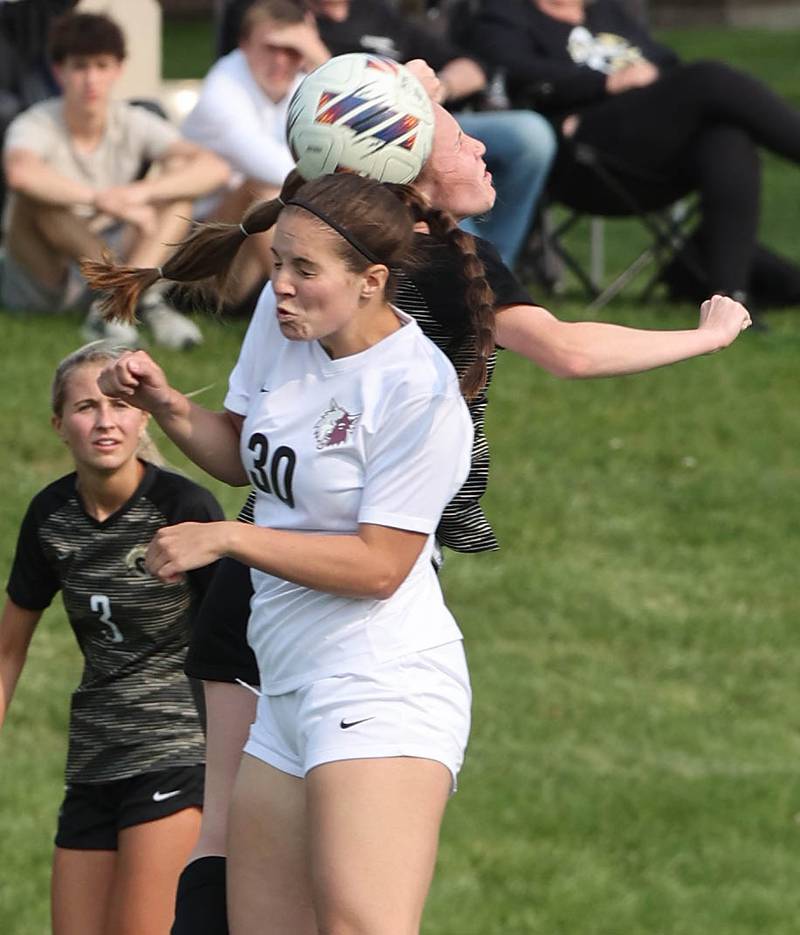 Prairie Ridge's Delanie Shorten and Sycamore's Cortni Kruizenga go for a header during their game Wednesday, May 17, 2023, at Sycamore High School.