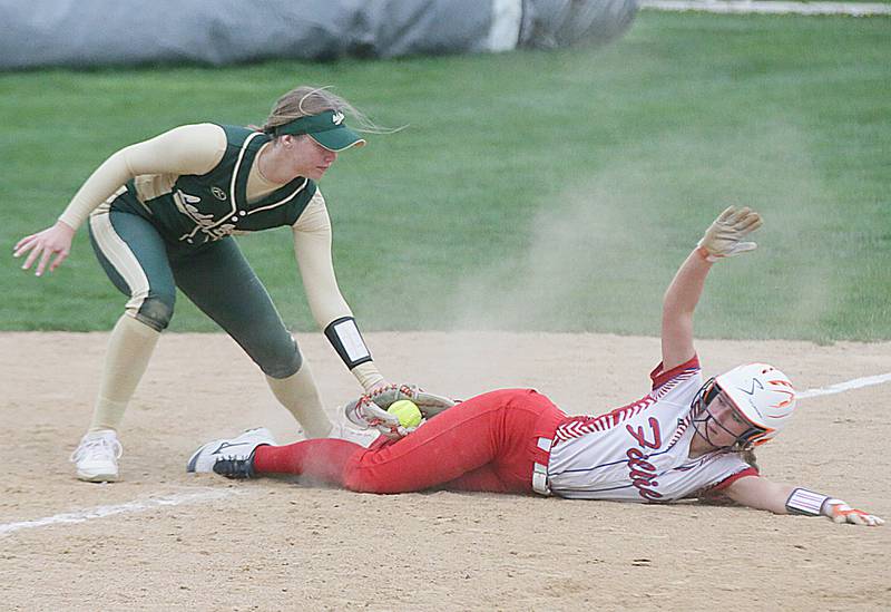 St. Bede's third baseman Ryann Stoudt (00) misses a tag on Morrison's Marissa Folkers (2) on Friday, April 29, 2022 at the Academy in Peru.