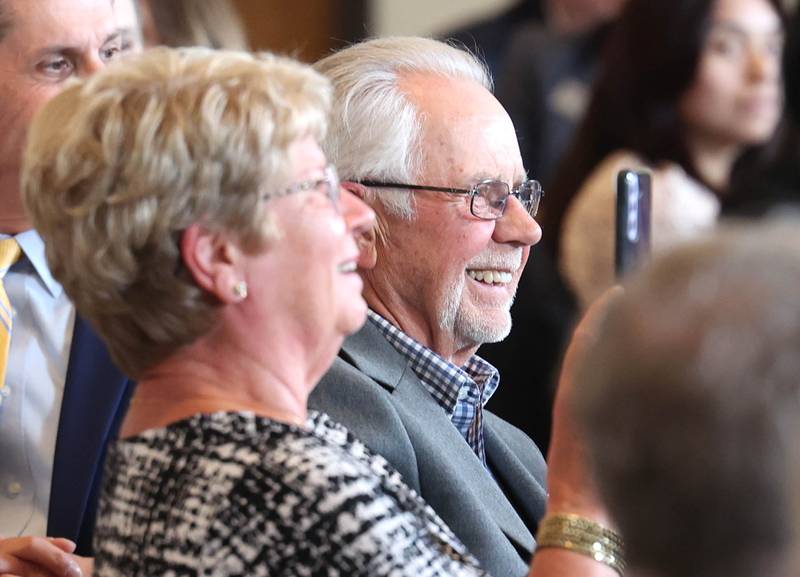 Ed Kuhn, smiles as his wife takes video, of his introduction as the Clifford Danielson Outstanding Citizen Award winner during the 107th Annual Sycamore Chamber of Commerce Meeting Thursday, March 7, 2023, in Memorial Hall at St. Mary's Catholic Church in Sycamore.