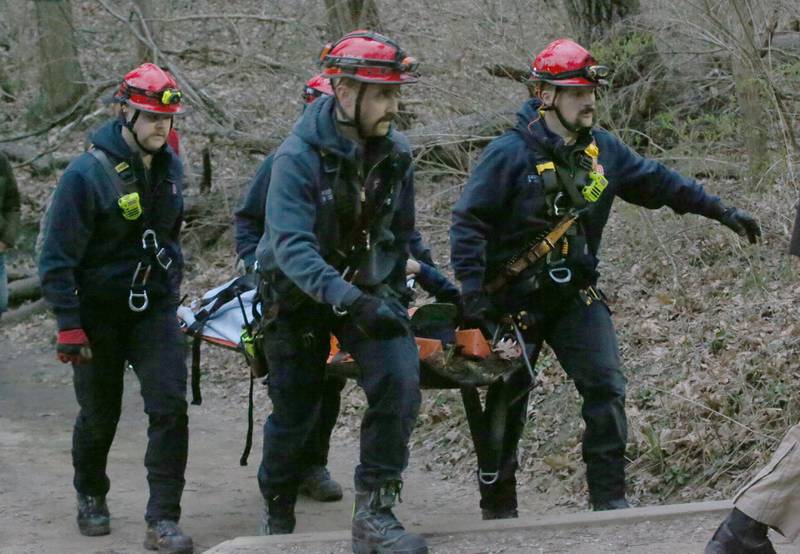 Firefighters carry a patient out of French Canyon who fell 20-30 feet on Tuesday, April 1, 2025 at Starved Rock State Park. A Mutual Aid Box Alarm System (MABAS) prompted rope and rescuers as far as Marseilles and Princeton.