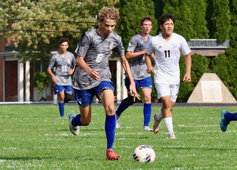 Princeton's Jackson DeRose tracks down the ball in Saturday's regional quarterfinal soccer match vs. Stanford Olympia at Bryant Field. The Tigers won 6-2.