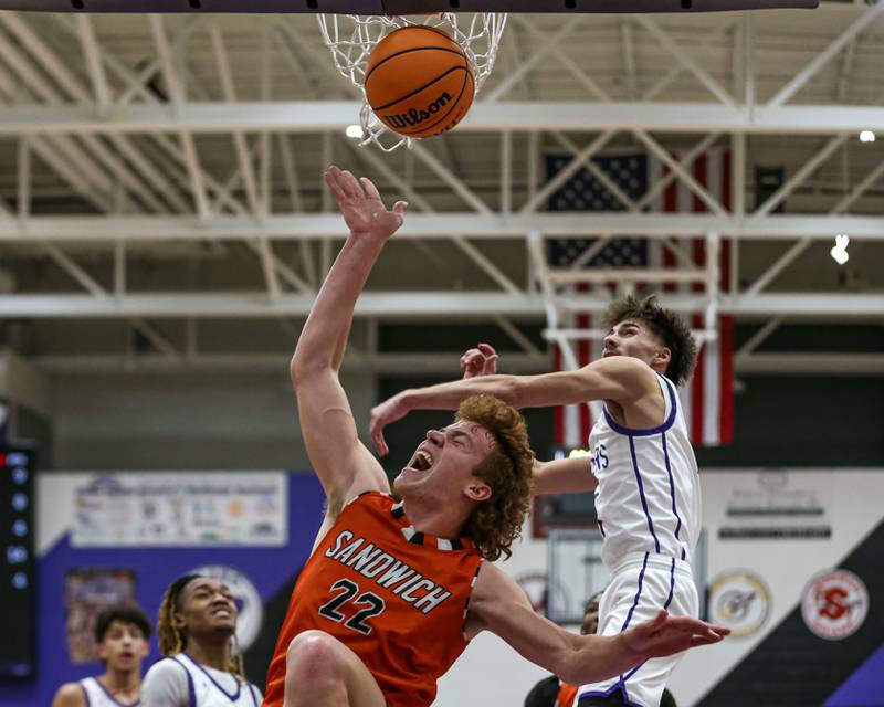 Sandwich's Dom Rome (22) is fouled on a layup attempt during their basketball game between Sandwich at Plano. Jan 27, 2025 in Plano.