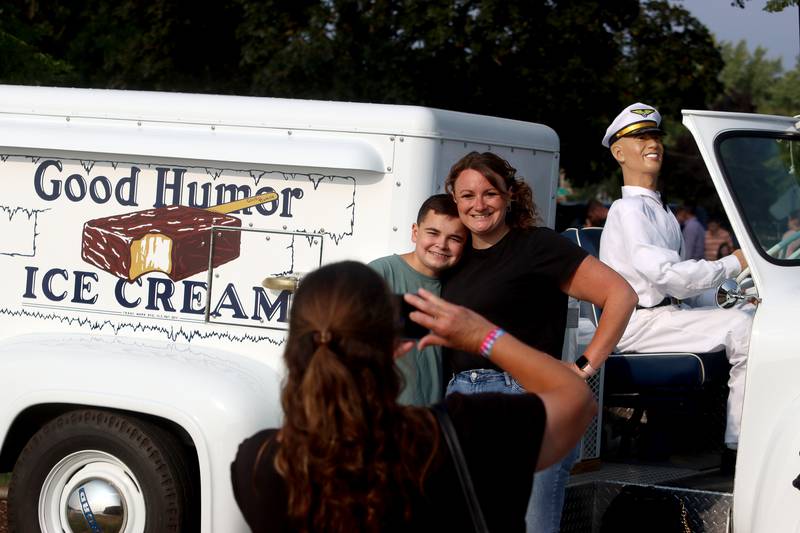 Nathan Bowe, 15, and his mom Sally of Crystal Lake pose for a selfie by a vintage ice cream delivery truck Friday, Aug. 18, 2023, during Julie Ann’s first-ever Ice Cream Fest at Crystal Lake’s Main Beach. Nathan’s grandma Robin Kosek of Crystal Lake takes the picture.