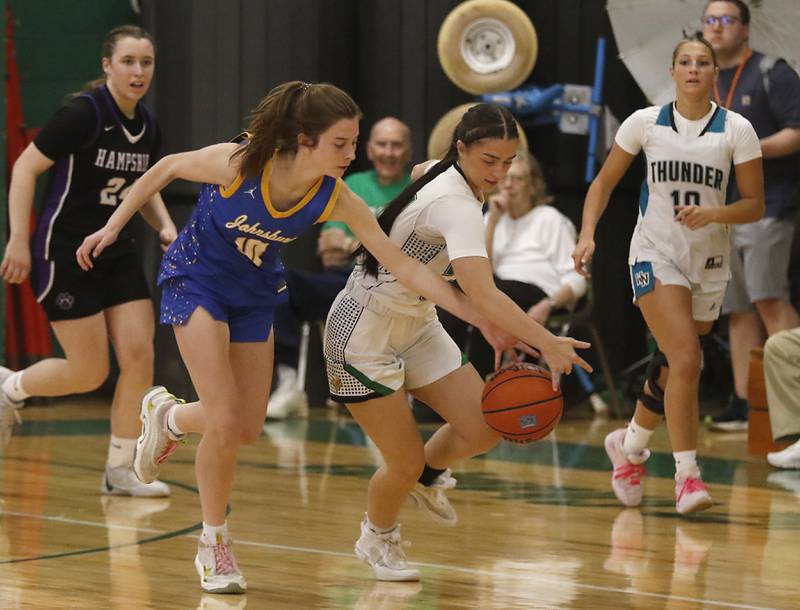 Johnsburg’s Wynne Oeffling tries to steal the ball from North Boone’s Payton Tuley during the girl’s game of McHenry County Area All-Star Basketball Extravaganza on Sunday, April 14, 2024, at Alden-Hebron’s Tigard Gymnasium in Hebron.
