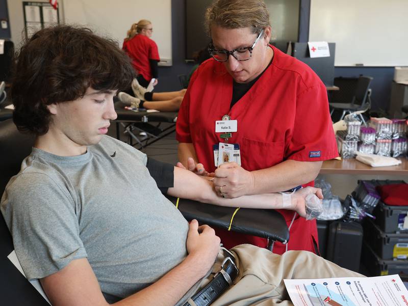 Student Chris Gedraitis gives blood with the help of American Red Cross Katie Scheid during the Saint Bede Community Blood Drive on Tuesday, Nov. 4 in the Perino Science Center at St. Bede Academy. The goal was to collect 100 pints this school year. If the school reaches it's goal, the Red Cross will award a $1,000 scholarship to one graduating senior.