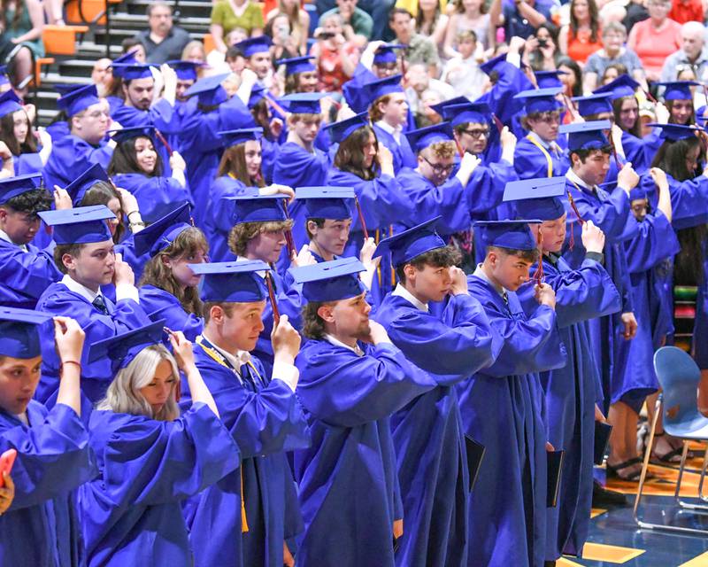 Genoa-Kingston High School seniors move their tassels from the right side to left at their graduation ceremony Saturday, May 18, 2024, at the high school, 980 Park Ave. in Genoa.