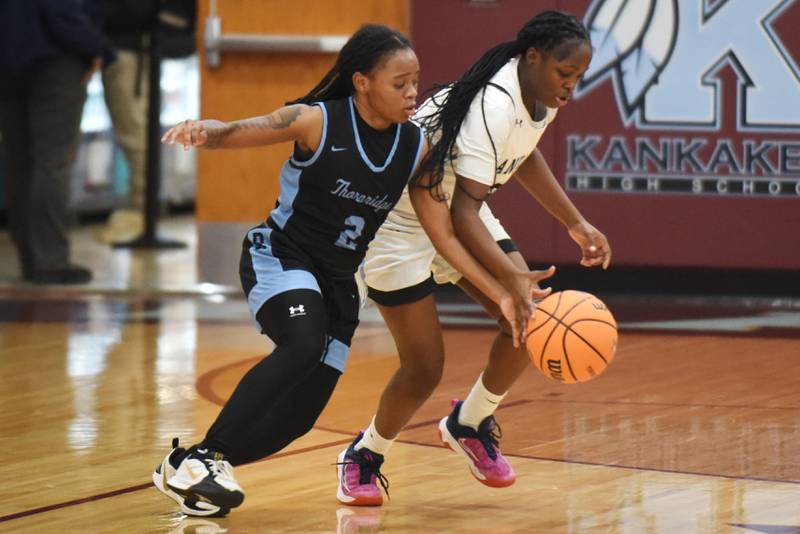 Kankakee's London Stroud, right, looks to steal the ball from Thornridge's Nevaeh Owens during a game at Kankakee Thursday, Jan. 8, 2026.