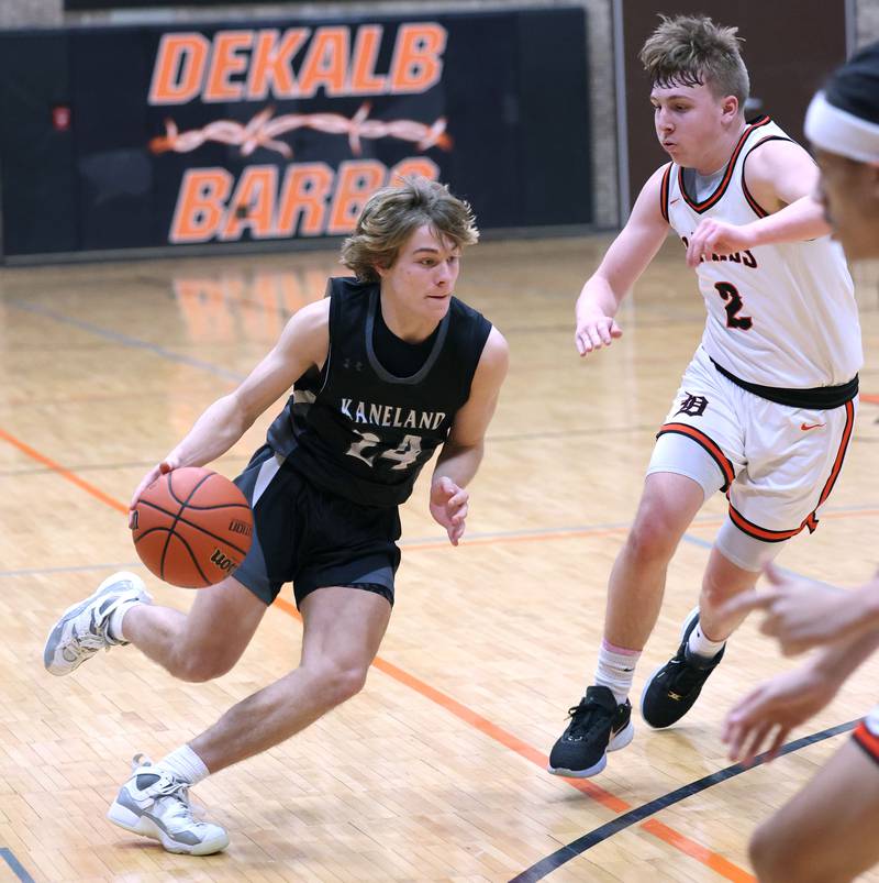 Kaneland's Luke Reinert tries to drive past DeKalb’s Sean Reynolds during their game Monday, Feb. 12, 2024, at Huntley Middle School in DeKalb.