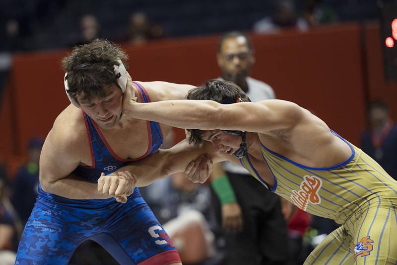 St. Viator’s Jaxon Penovich (left) works against Mahomet’s Marco Casillas in the 190 pound title Saturday, Feb. 21, 2026, at the IHSA wrestling finals in Champaign.