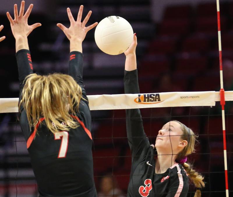 Barrington's Hope Regas (3) spikes the ball past Benet's Audrey Asleson (7) in the Class 4A semifinal game on Friday, Nov. 11, 2022 at Redbird Arena in Normal.