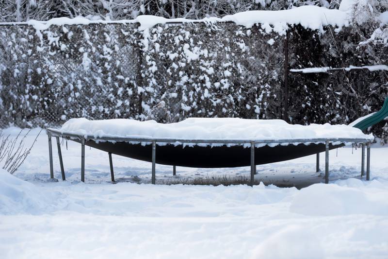 A trampoline sits loaded with snow in Mt. Morris on Saturday, Jan. 13, 2024. Friday's winter storm dumped 10-12 inches of snow on the village.