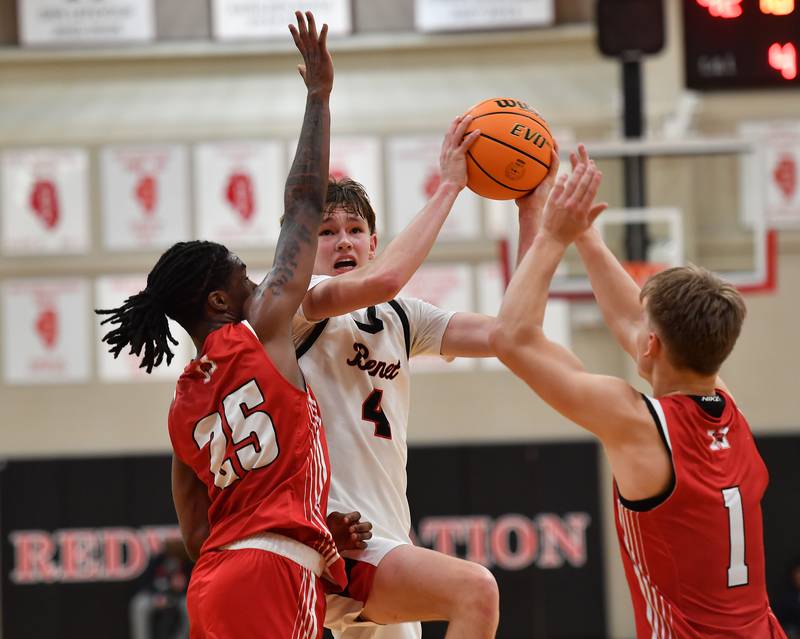 Benet’s Daniel Pauliukonis (4) goes to the basket during a game against Marist on Friday, Dec. 13, 2024 at Benet Academy in Lisle.