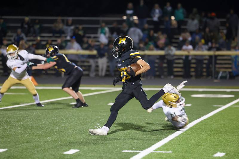 Herscher's Mason Roberts avoids a Bishop McNamara defender as he returned the kickoff 89 yards for a touchdown during the Tigers' 45-28 loss to Bishop McNamara on Friday, Sept. 5, 2025.