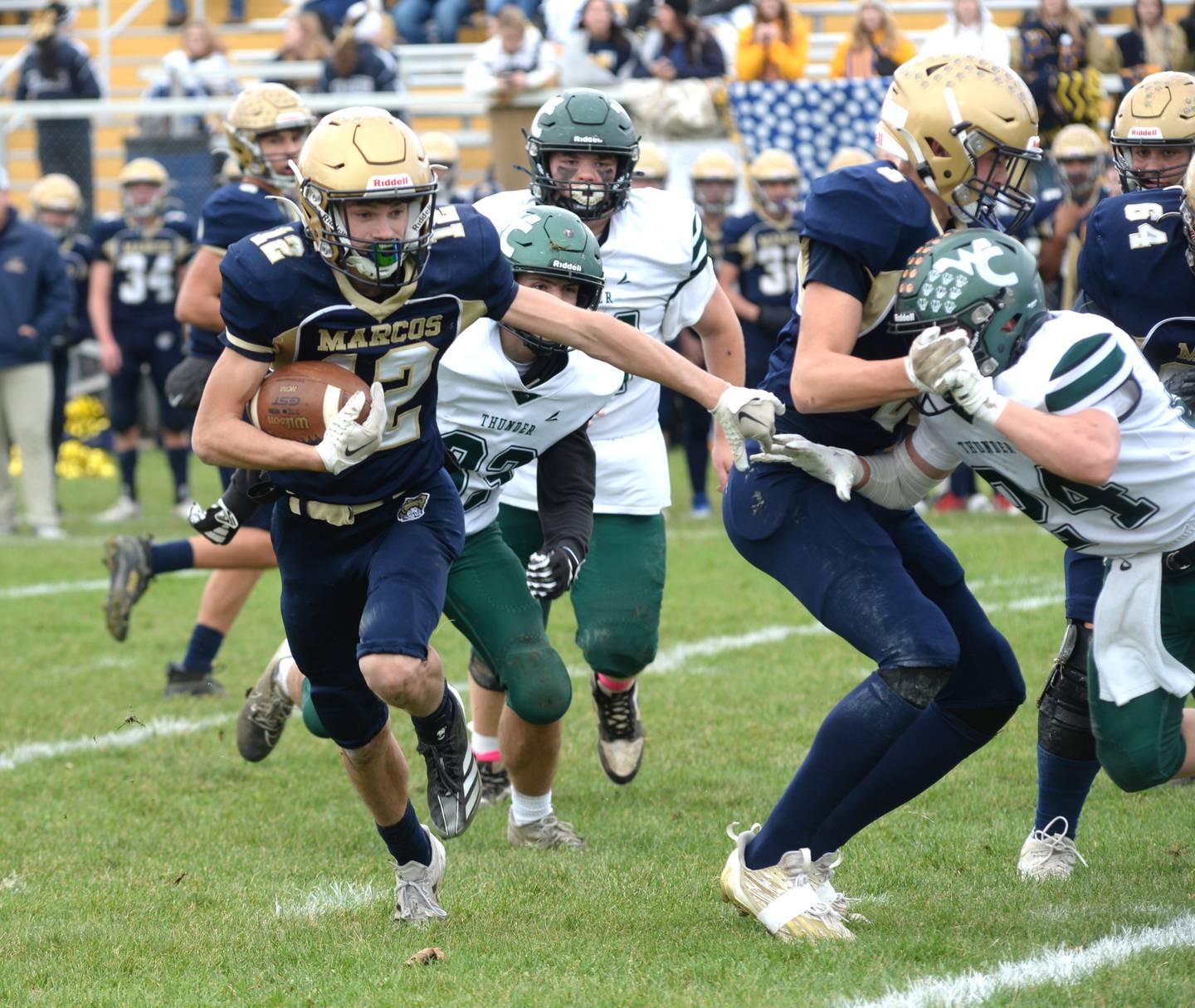 Polo's Billy Lowry (12) runs for yards against West Carroll during 8-man football playoff action on Saturday, Nov. 9, 2024 at Polo High School.
