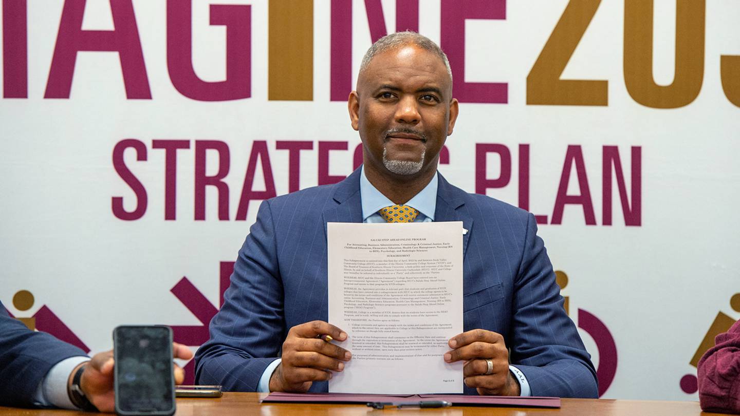 Southern Illinois University Carbondale Chancellor Austin A. Lane holds a Saluki Step Ahead agreement with Sauk Valley Community College from Wednesday, April 26, 2023.