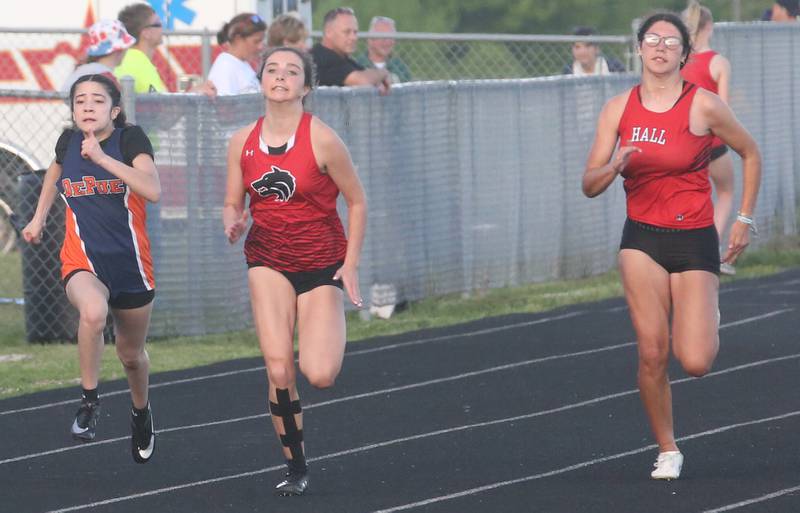 DePue's Sara Aguirre, Indian Creek's Riley Wilson and Hall's Elizabeth Wozek all compete in the 100 meter dash during the Class 1A Sectional meet on Wednesday, May 8, 2024 at Bureau Valley High School.