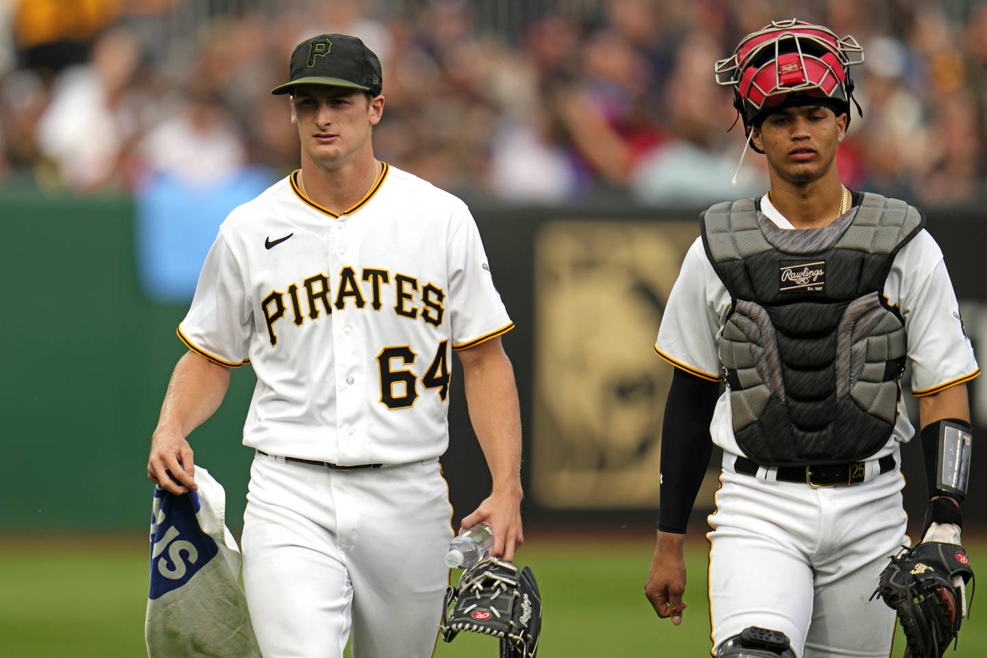 Pittsburgh Pirates starting pitcher Quinn Priester walks from the bullpen after warming up with catcher Endy Rodriguez for their major league debuts, Monday, July 17, 2023, against the Cleveland Guardians in Pittsburgh.