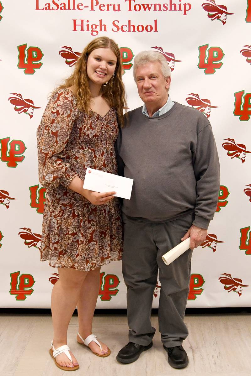 Makenzie Hamilton (left) received the $1,000 Thomas K. Kujawa Scholarship, named in memory of registered nurse and Vietnam War-era U.S. Army veteran Thomas Kujawa. The scholarship is awarded to an L-P senior who is pursuing a degree in nursing upon graduation. The scholarship was presented by Jim Lesczcynski (right).