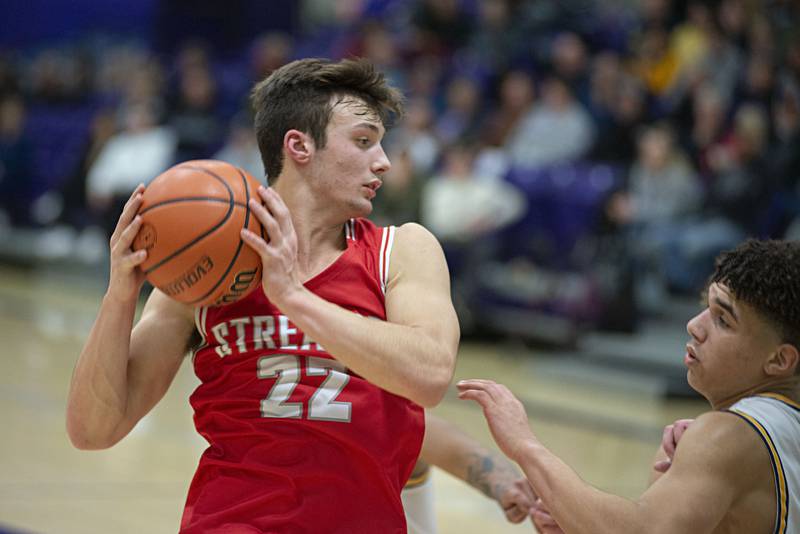 Streator's Christian Benning handles the ball against Sterling in a semifinal regional game on Wednesday, Feb. 23, 2022.