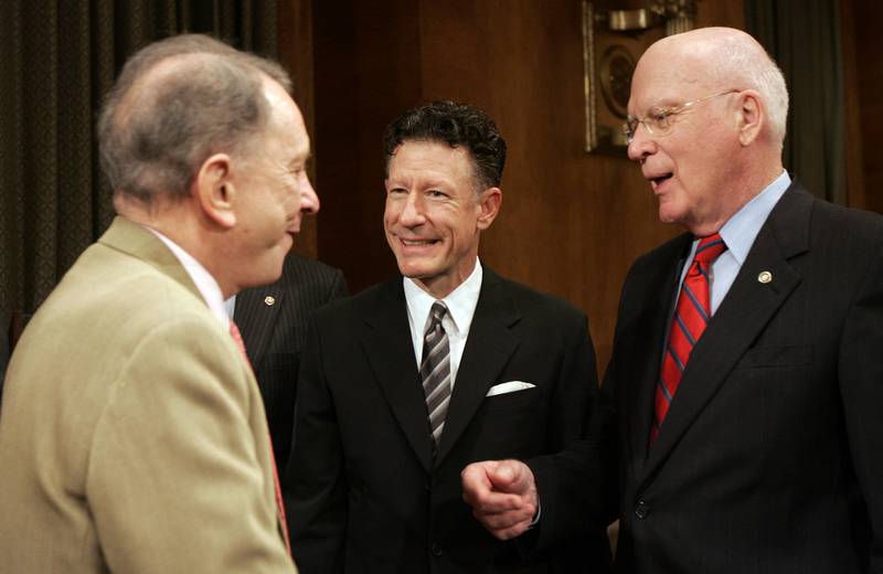 Texas musician Lyle Lovett, center, talks with Sen. Arlen Specter, R-Pa., left, and Sen. Patrick Leahy, D-Vt., right, on Capitol Hill in Washington, in this Nov. 13, 2007, file photo. (AP Photos/Susan Walsh)