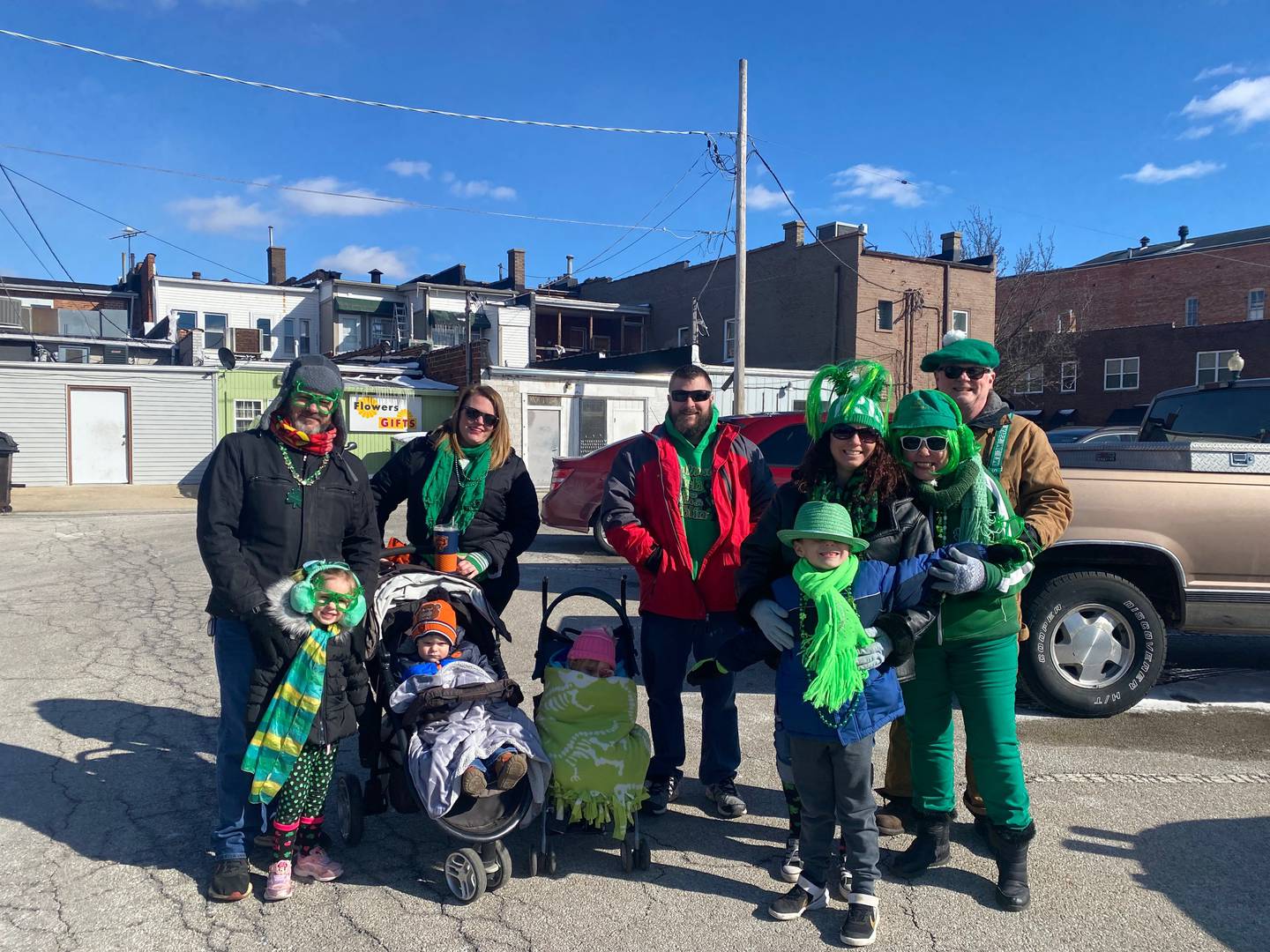 Left: Paul Van Yperen, Viviana Van Yperen, Trish Hedberg with baby Charlie Elias, Jeff Elias, Christina Van Yperen, Richard Van Yperen, Mary Pye, and Andy Pye attend the first St. Patrick's Day parade in Morris.