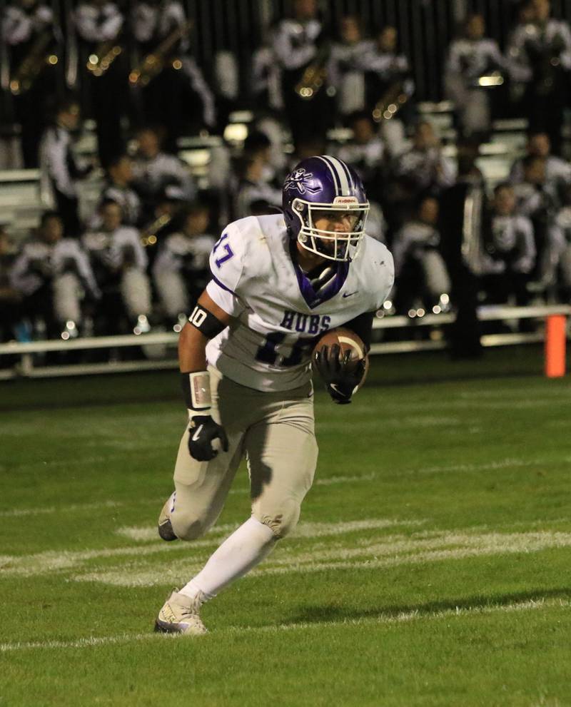 Rochelle's Reece Harris runs with the ball during Friday's game at Kaneland.